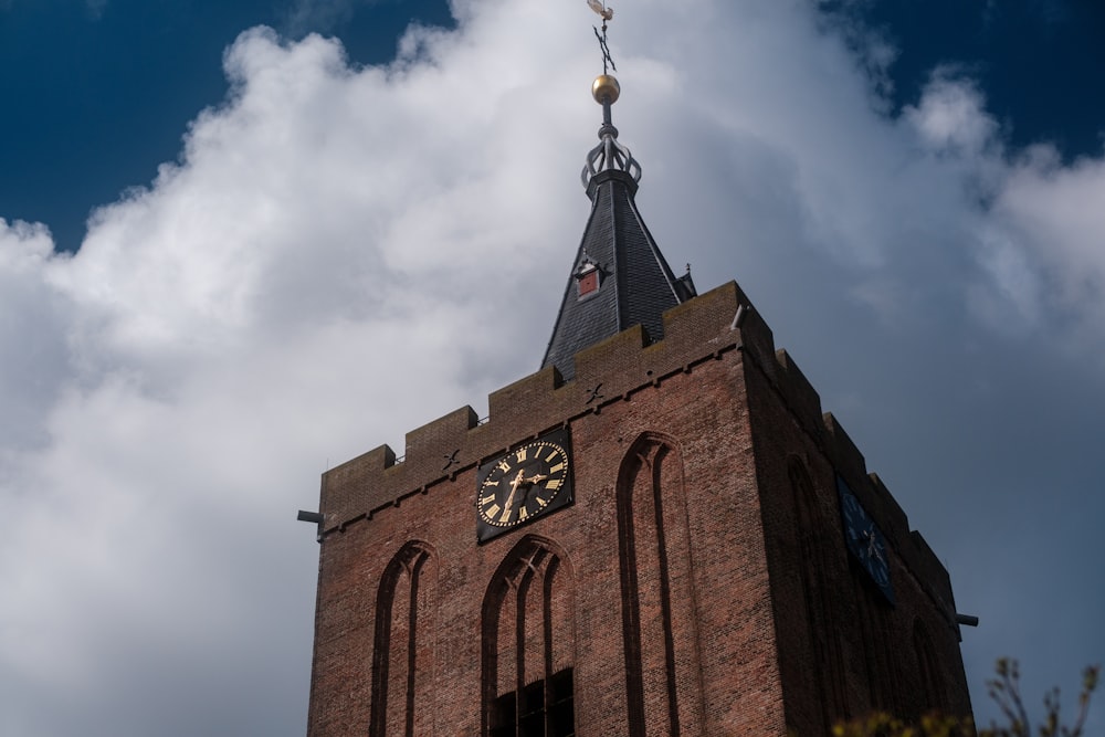 a clock tower with a weather vane on top