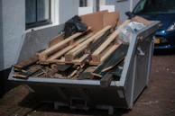 a pile of wood sitting next to a building