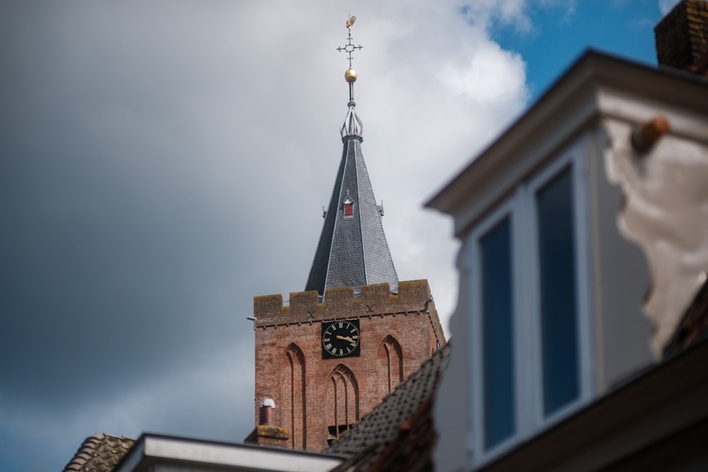 a church steeple with a clock on it