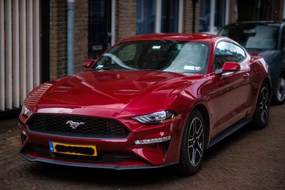 a red sports car parked in front of a building