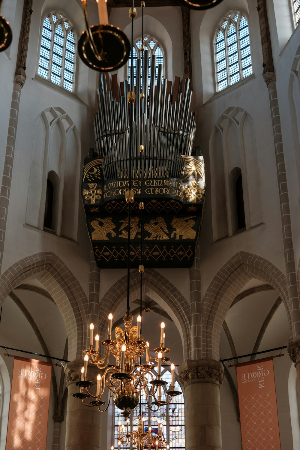 a church with a pipe organ hanging from the ceiling