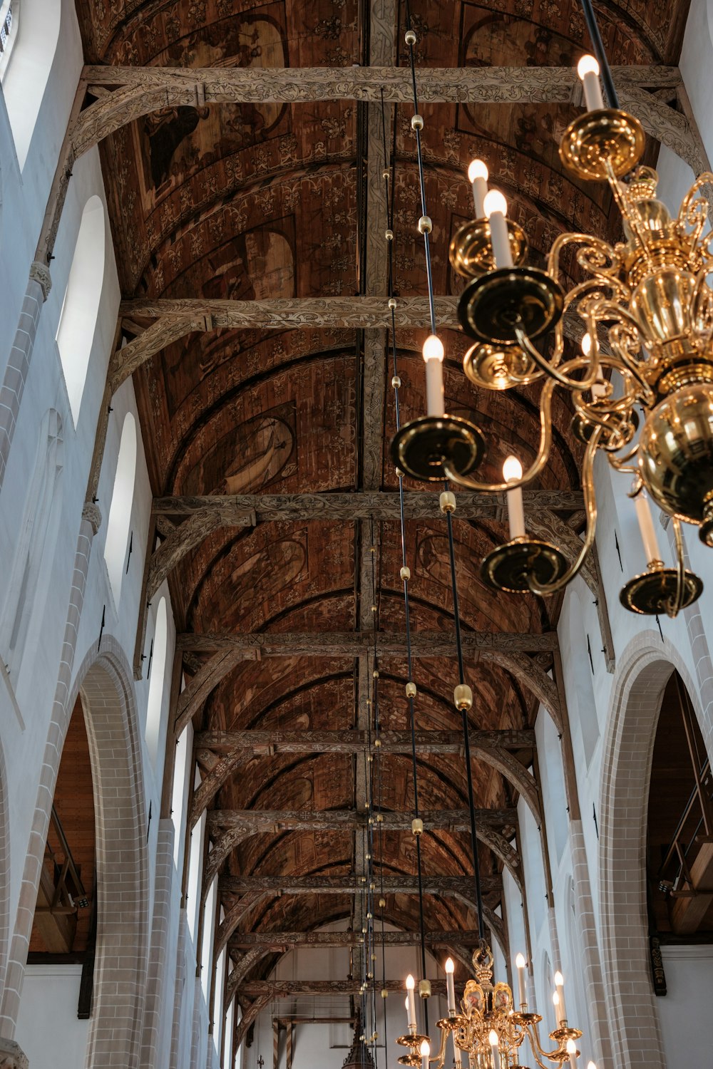 a large cathedral with a chandelier hanging from the ceiling