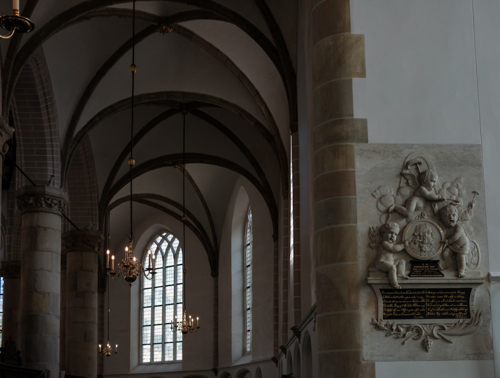 a cathedral with a statue of a man and a woman