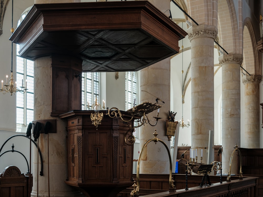 a large wooden clock in the middle of a room