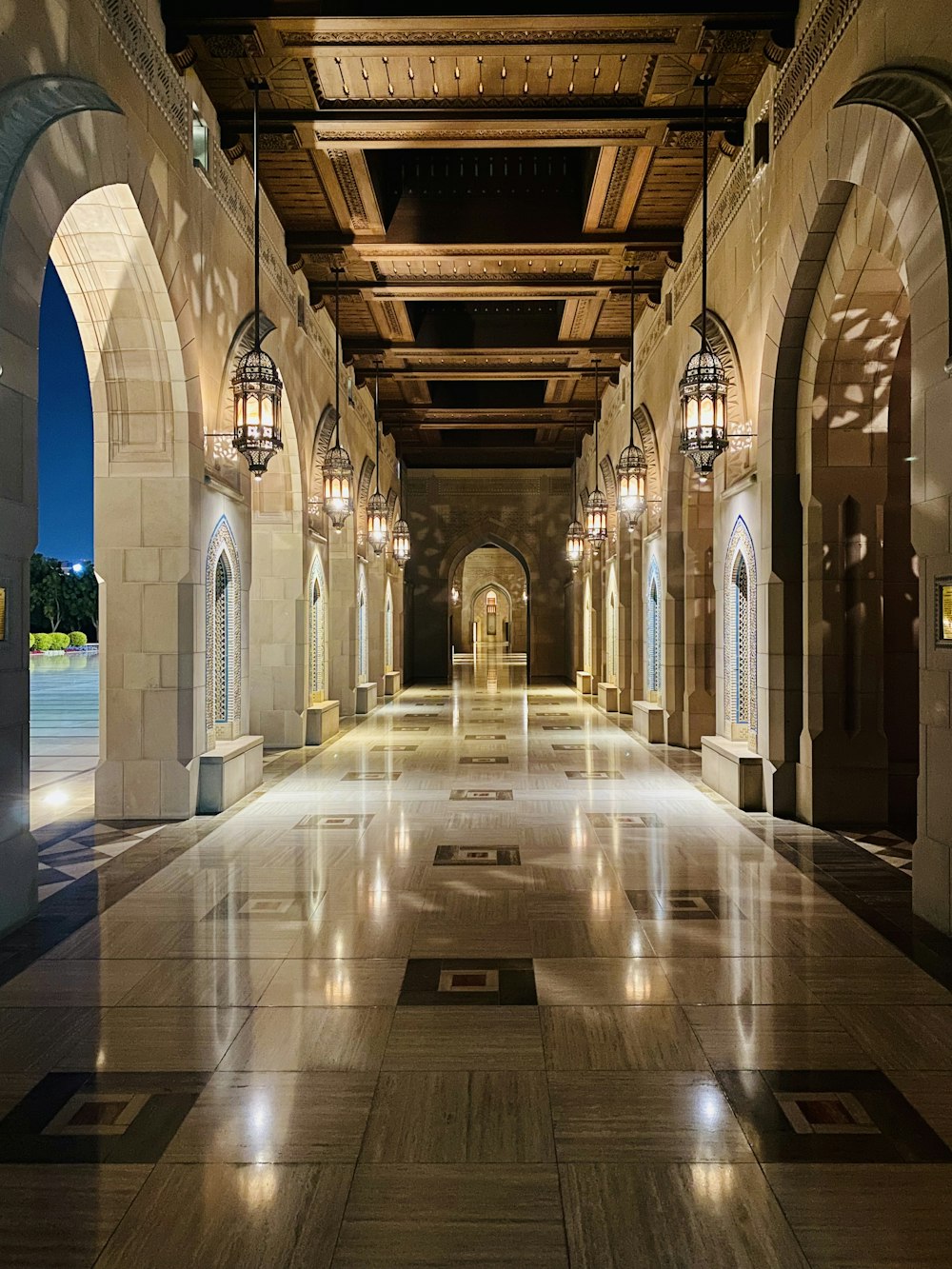 a long hallway with a lot of lights on the ceiling