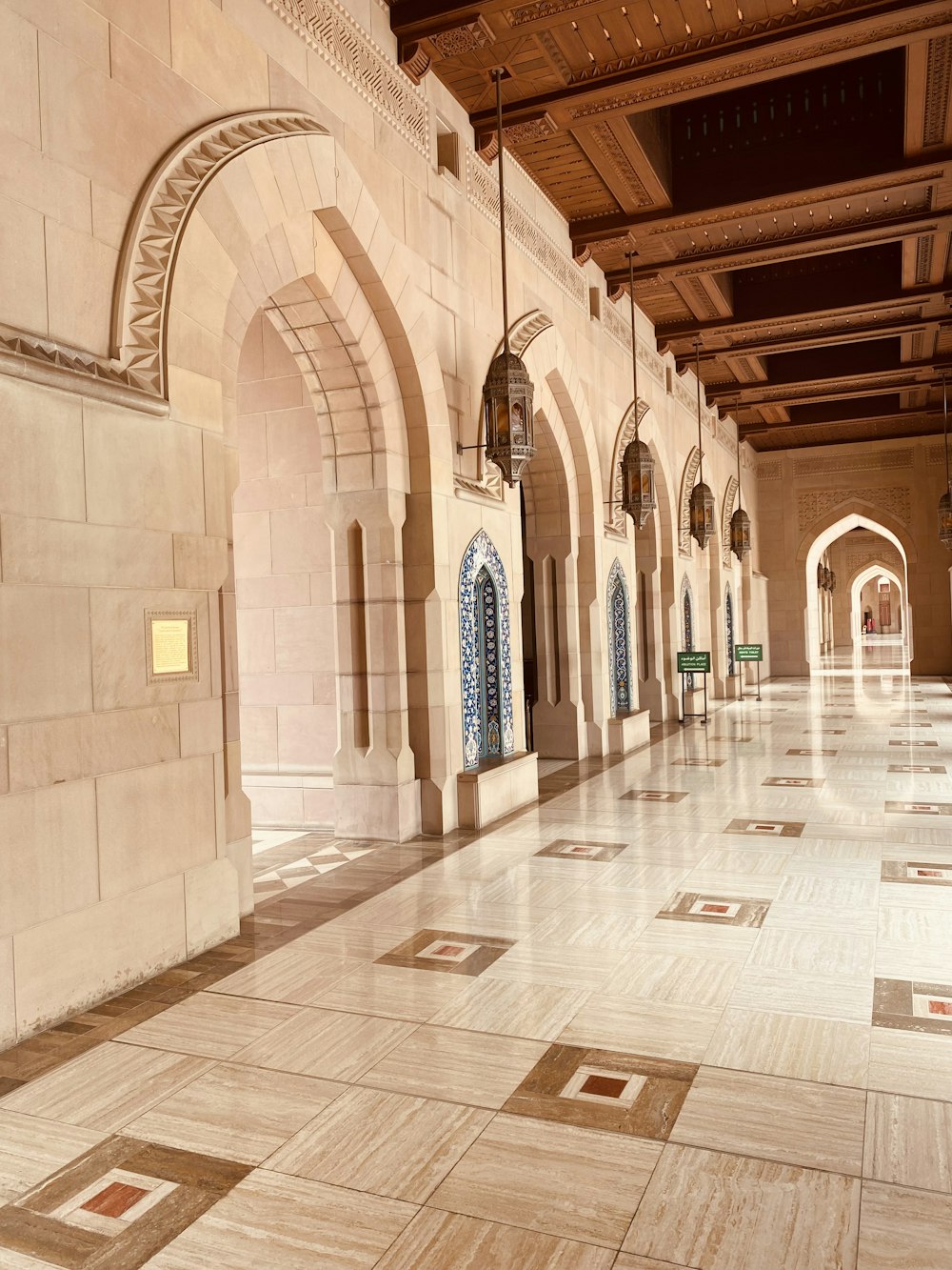 a long hallway with a clock on the wall