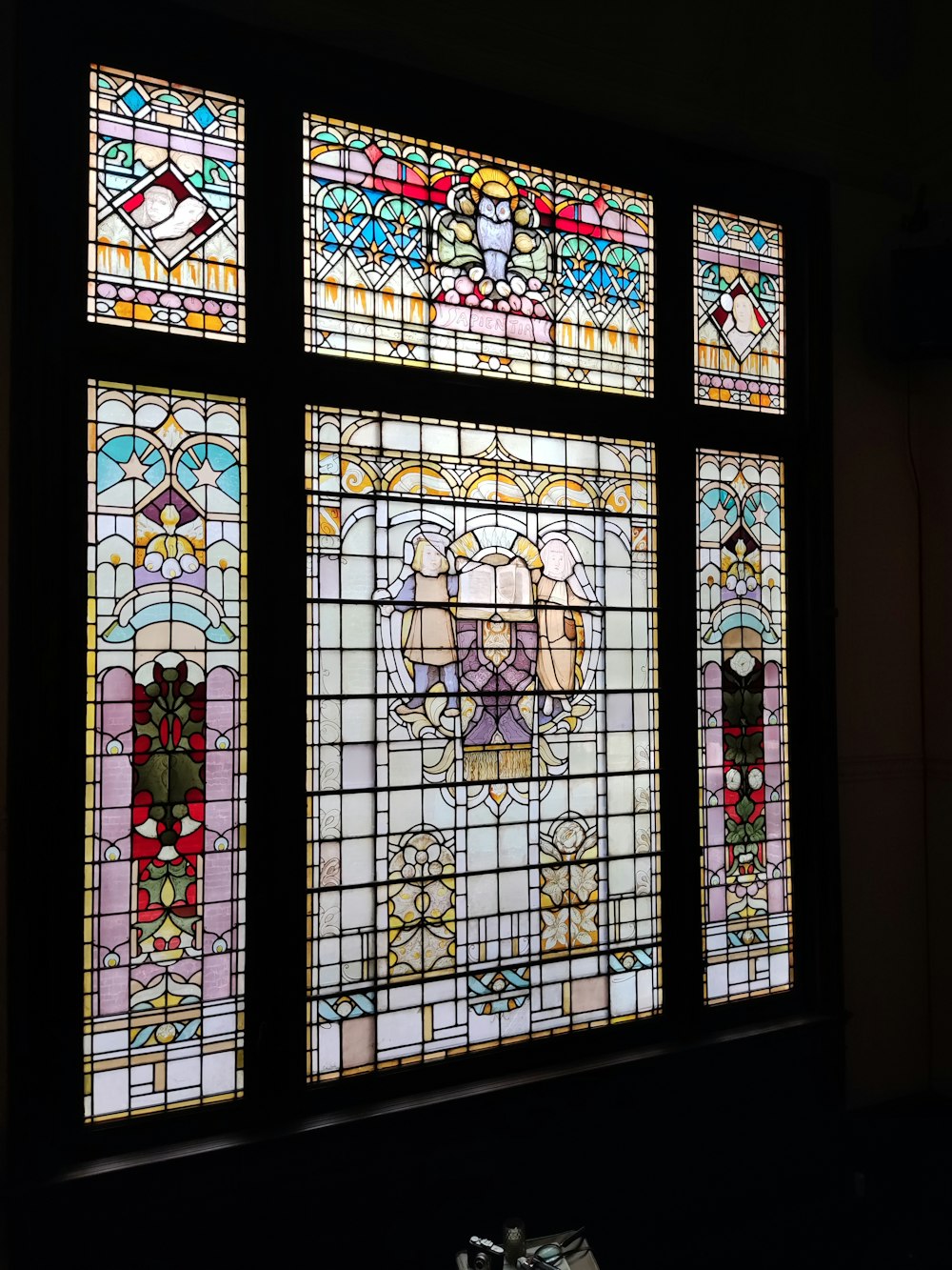 a stained glass window with a dog on it