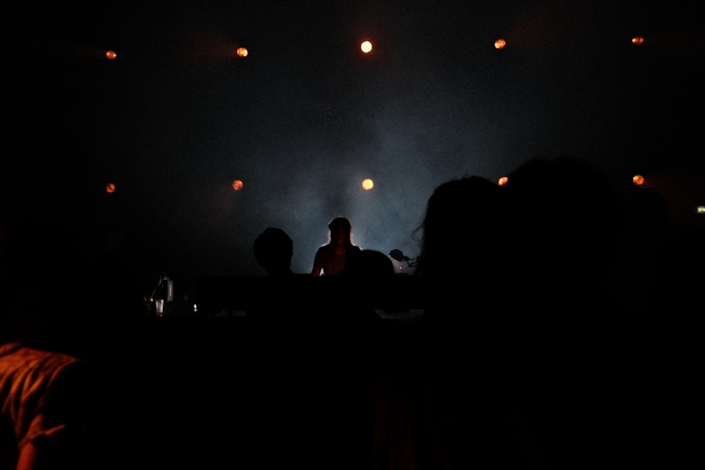 a group of people standing on top of a stage