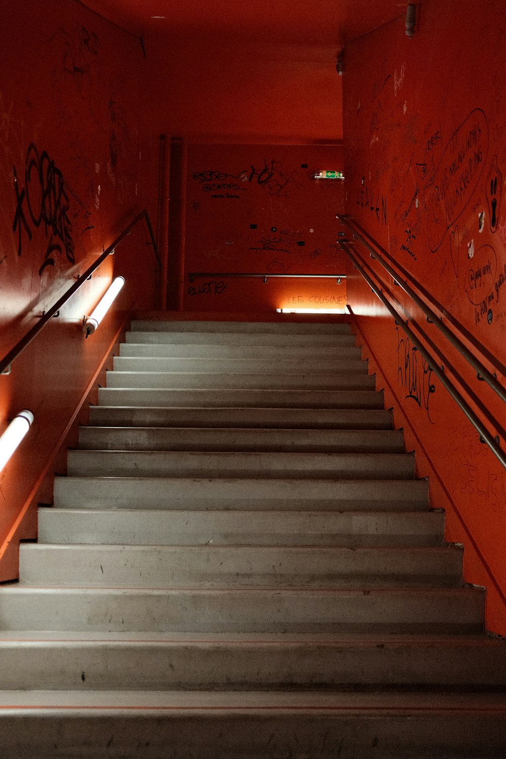 a set of stairs with graffiti on the walls