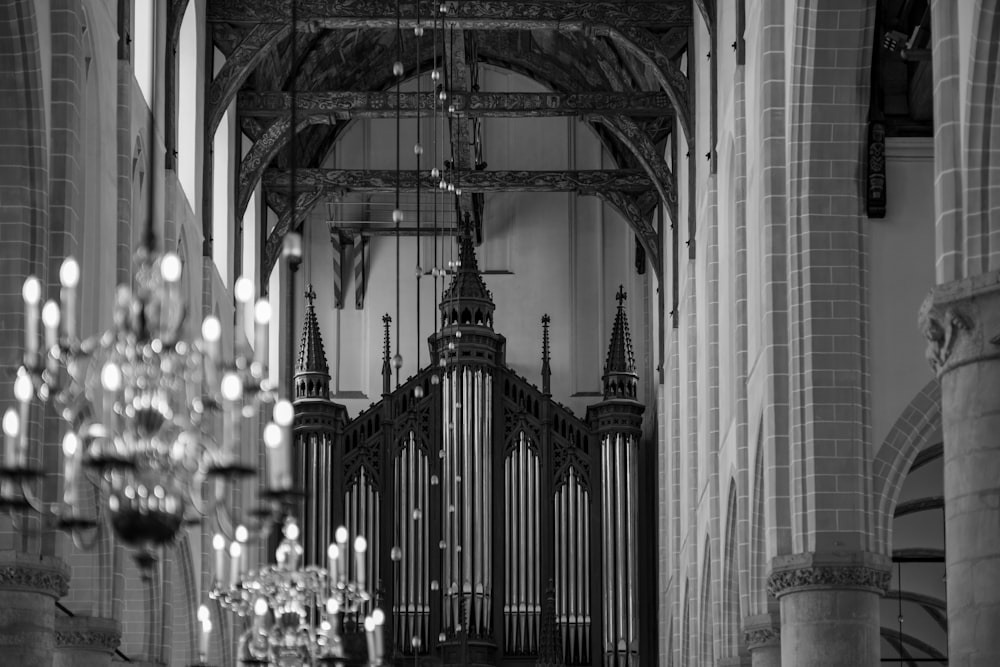 a black and white photo of a church organ