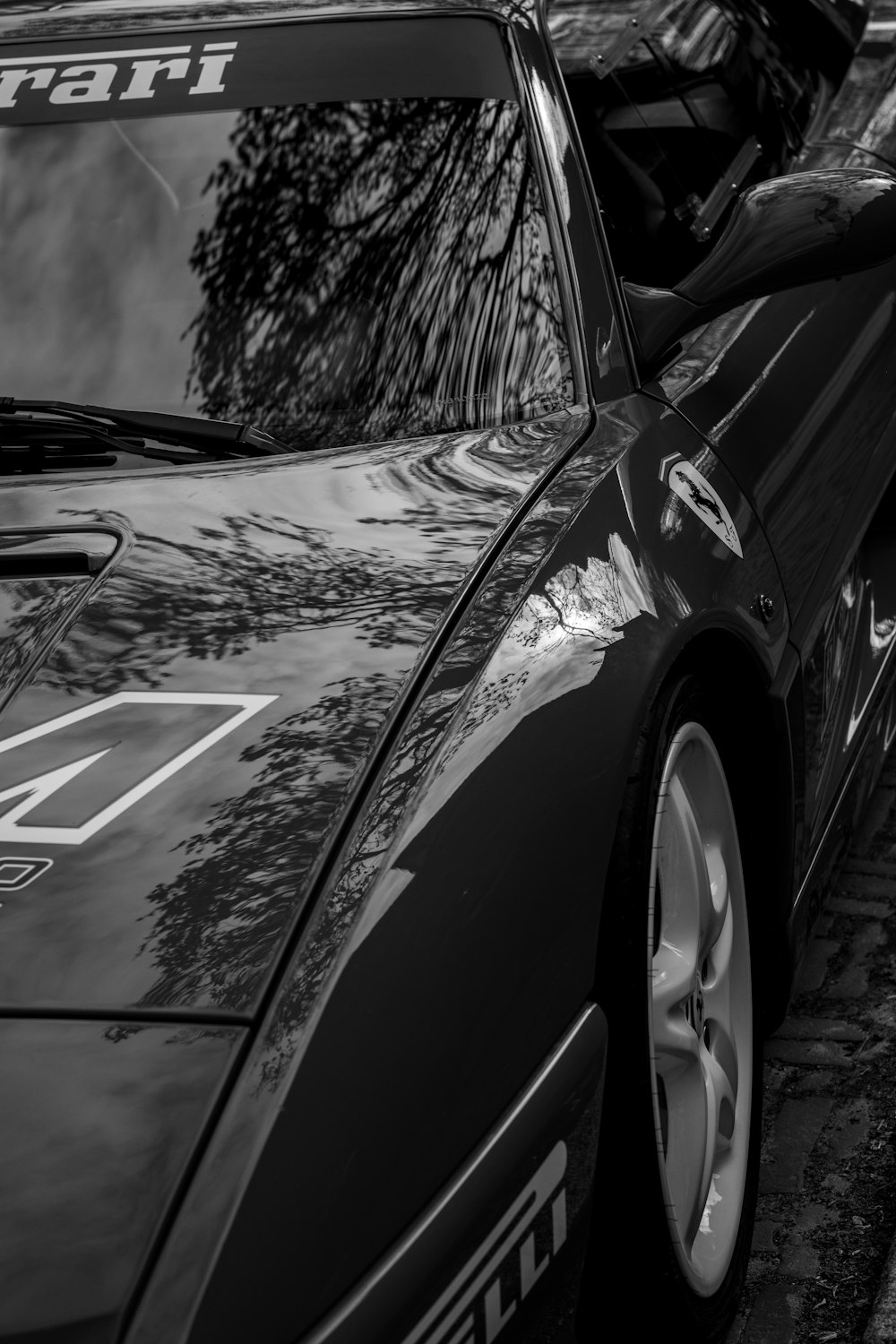 a black and white photo of a sports car