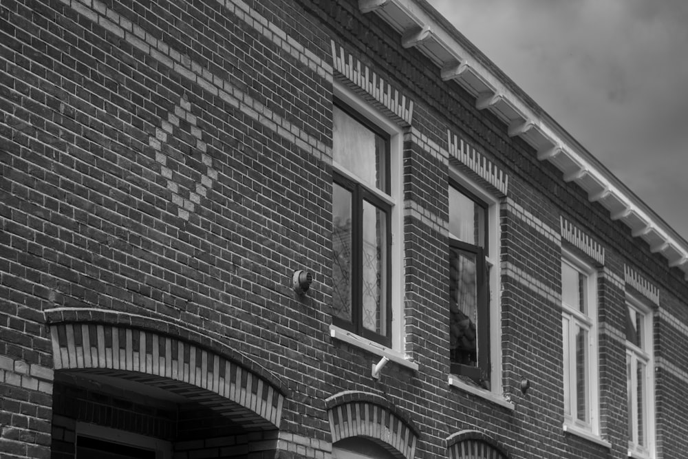 a black and white photo of a brick building