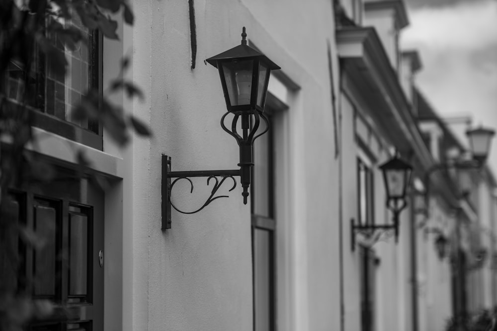 a black and white photo of a street light