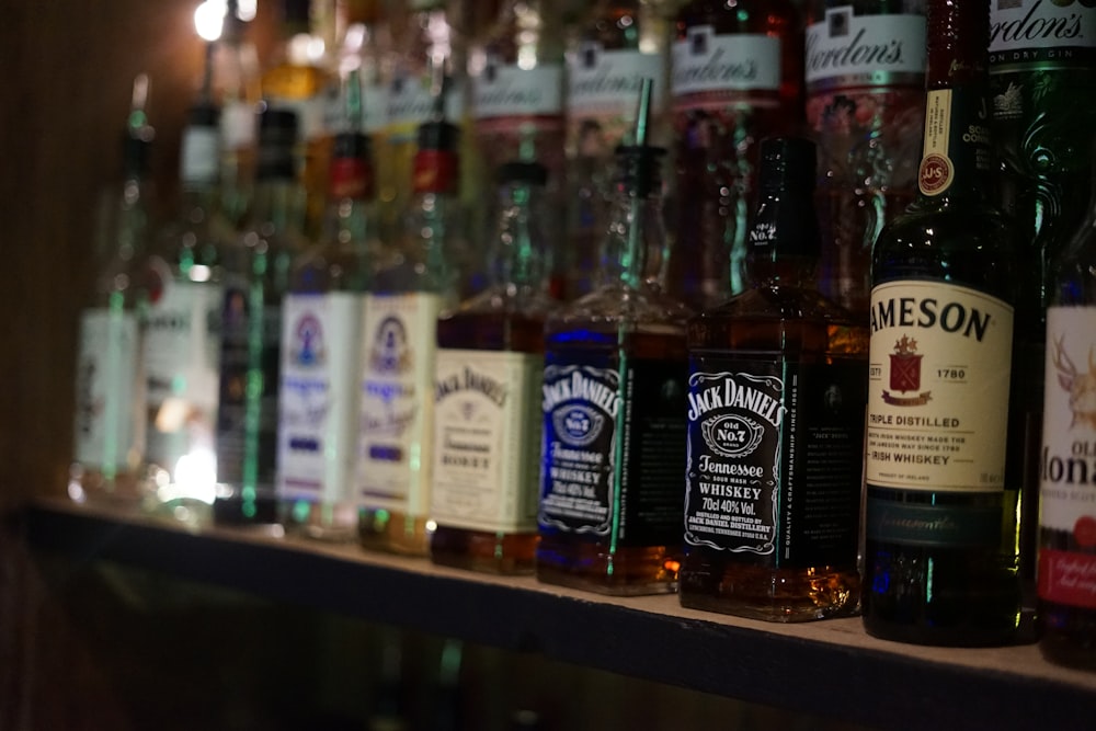 a row of liquor bottles on a shelf