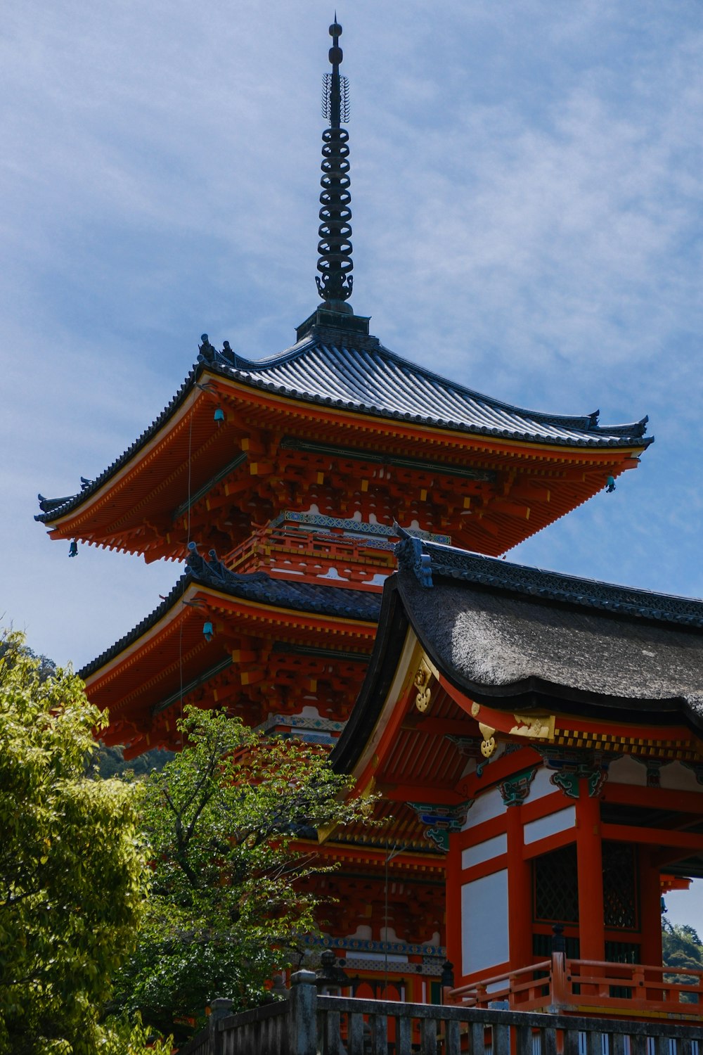 a tall building with a tall tower in the background