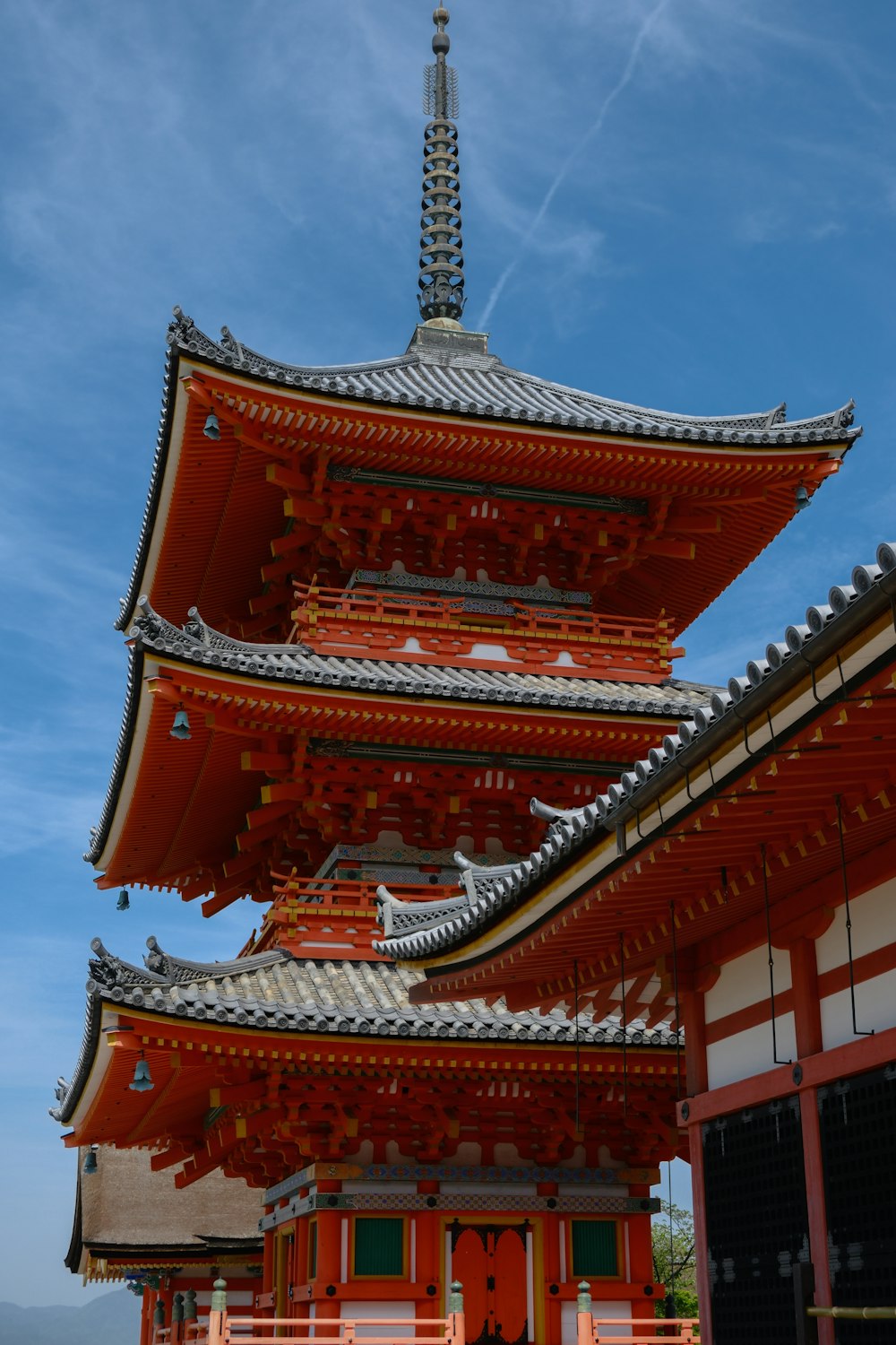 a tall red building with a sky in the background