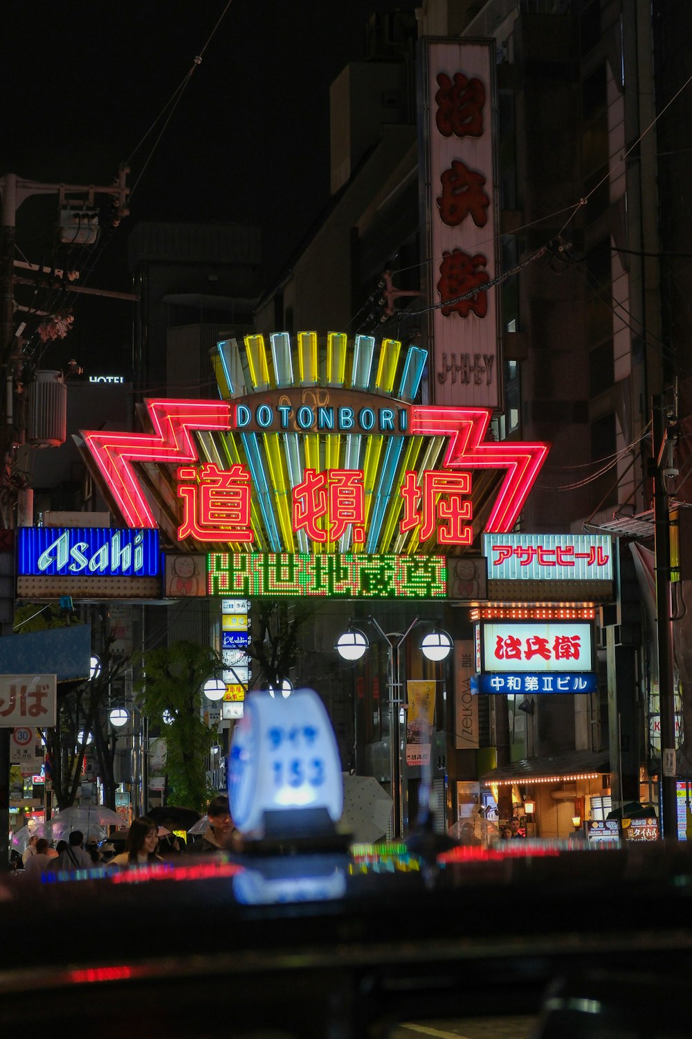 a city street filled with lots of neon signs