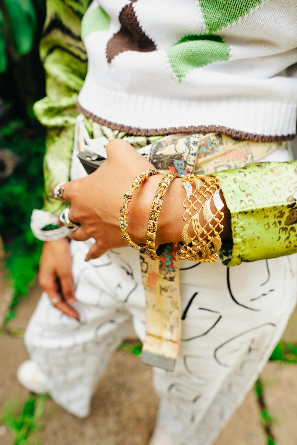 a woman wearing bracelets and bracelets on her arm