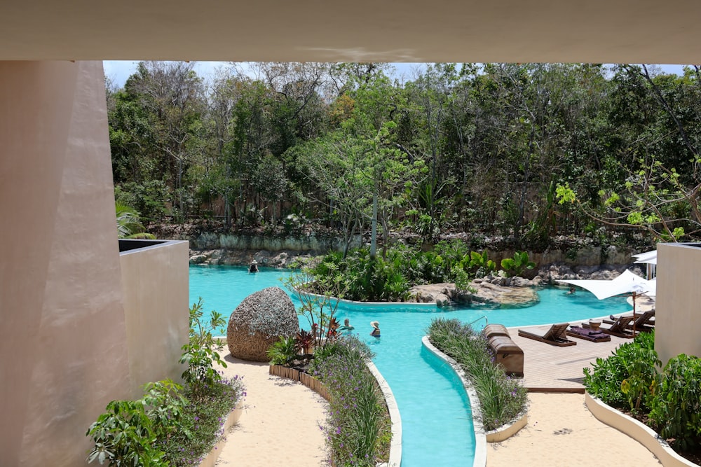 a view of a pool from inside a building