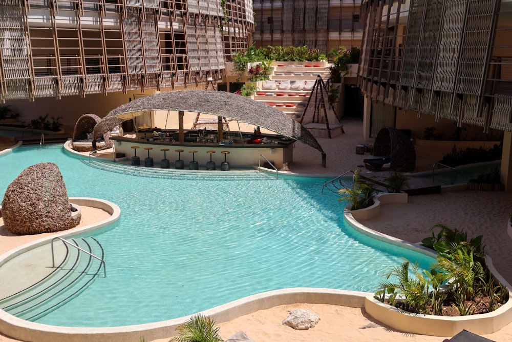 a swimming pool with a rock in the middle of it