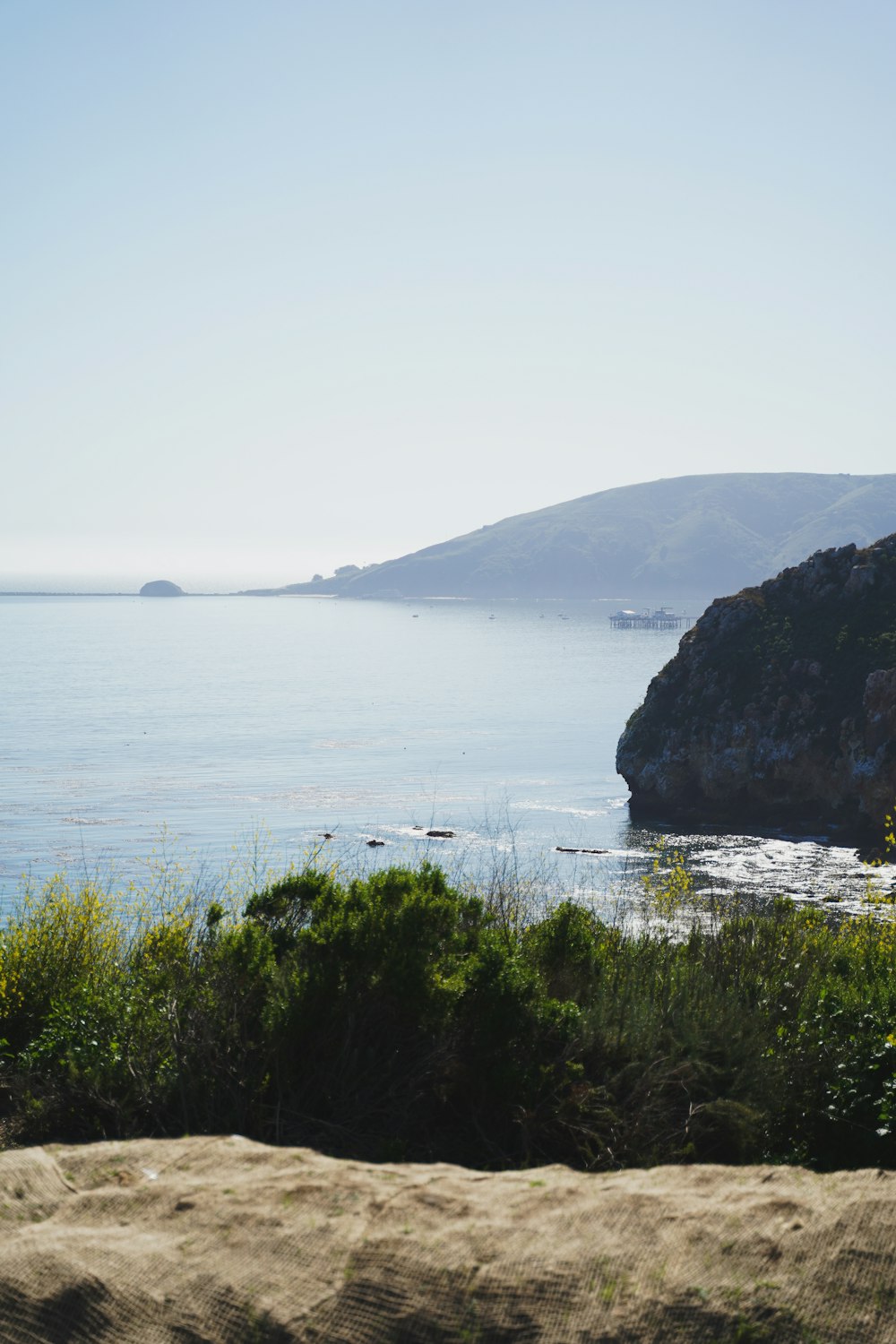 a view of a body of water with a mountain in the background