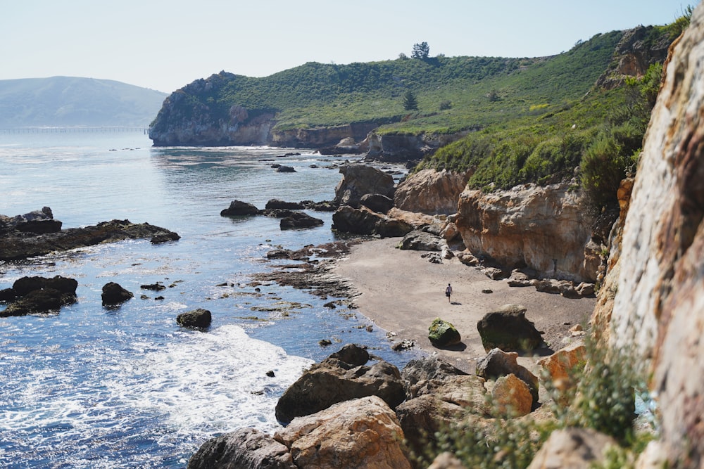a view of a rocky beach with a body of water