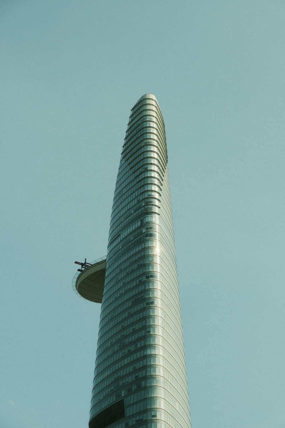 a very tall building with a sky background