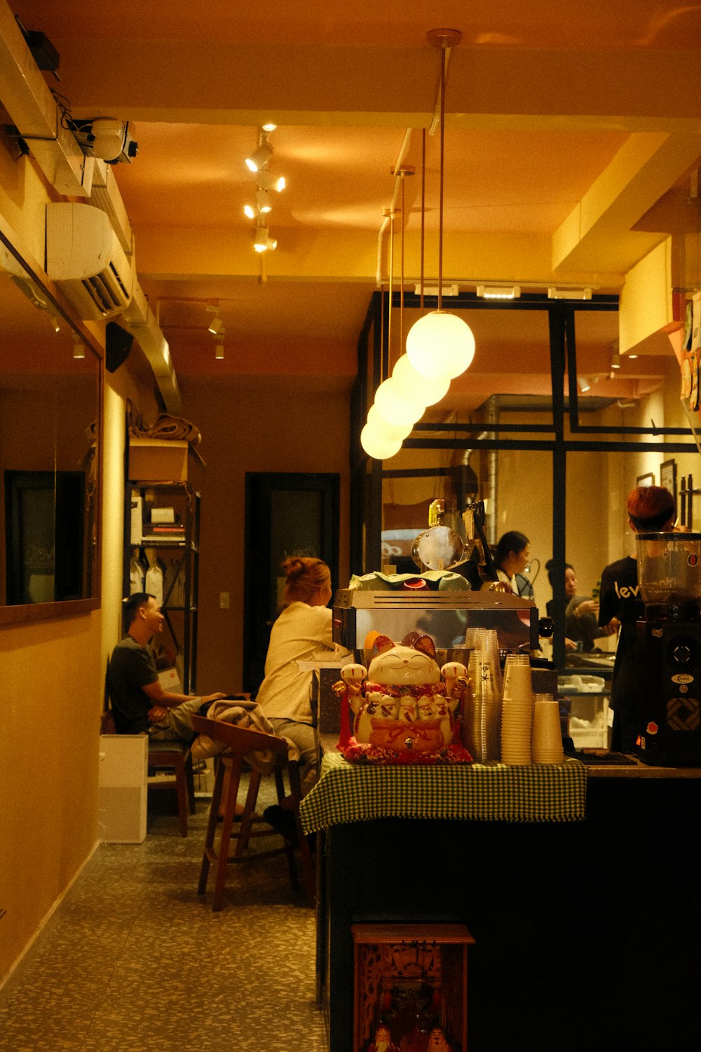 a group of people sitting at a table in a restaurant