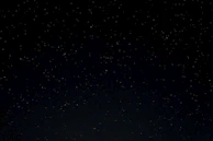 a night sky with stars and trees in the foreground