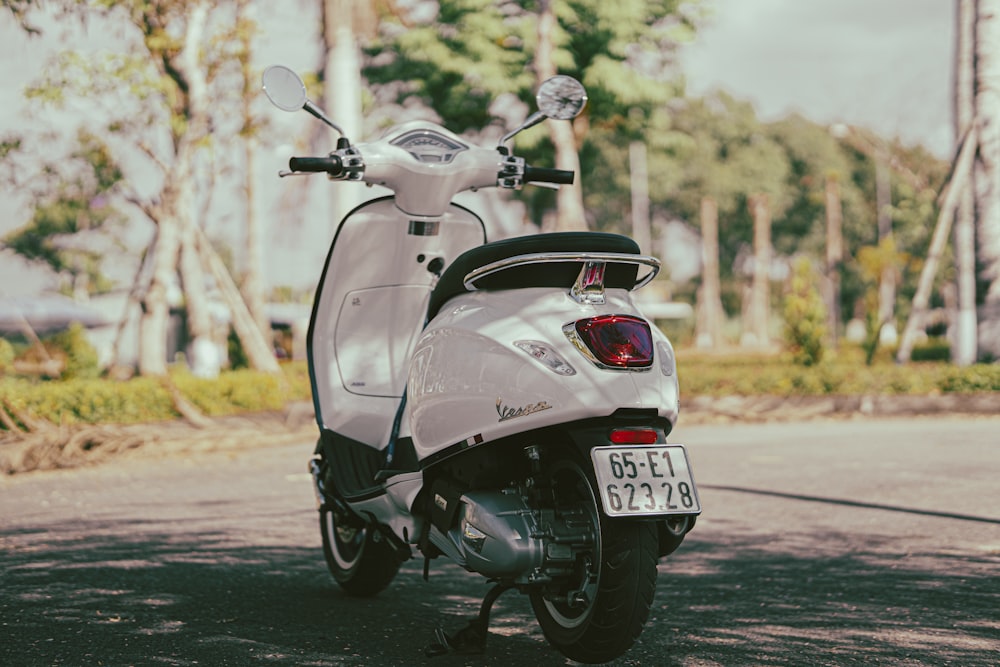 a scooter parked on the side of the road