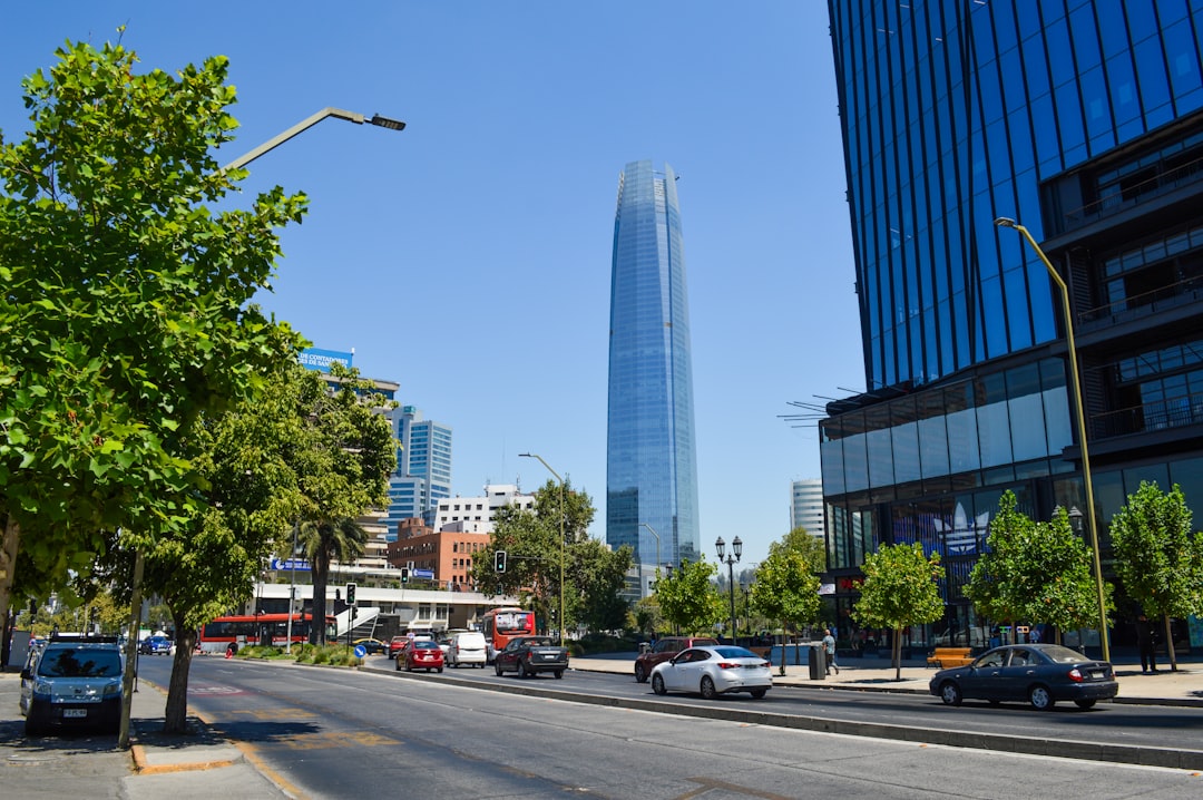 a very tall building towering over a city,