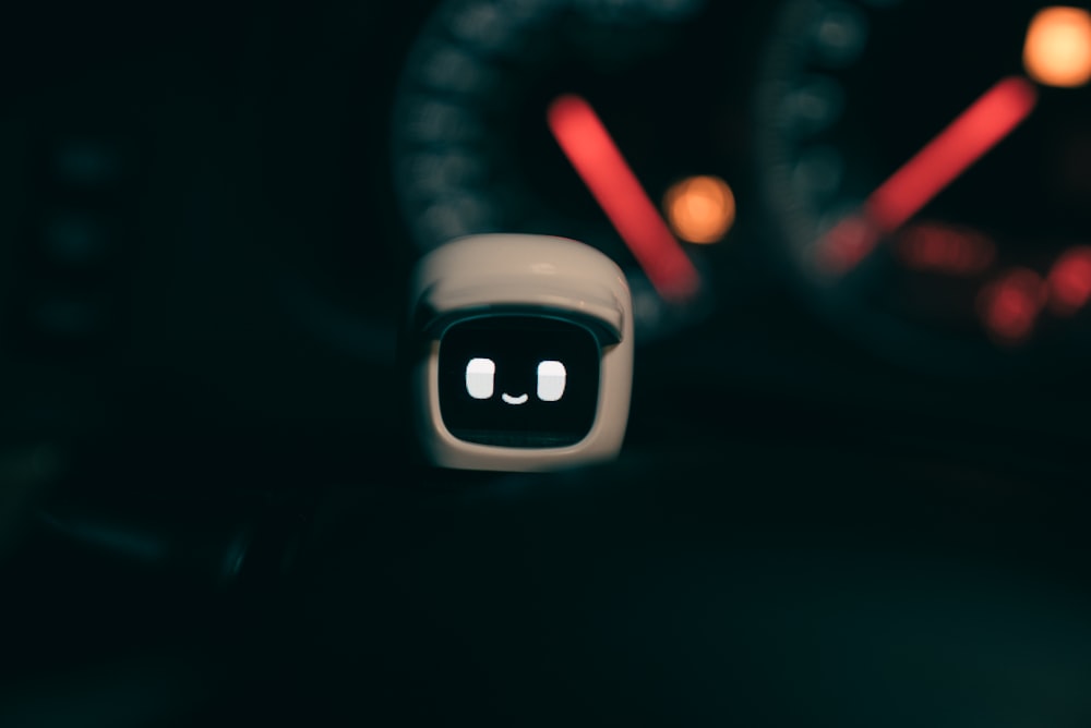 a close up of a car dashboard with a camera