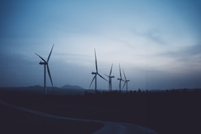 a group of wind turbines in a field