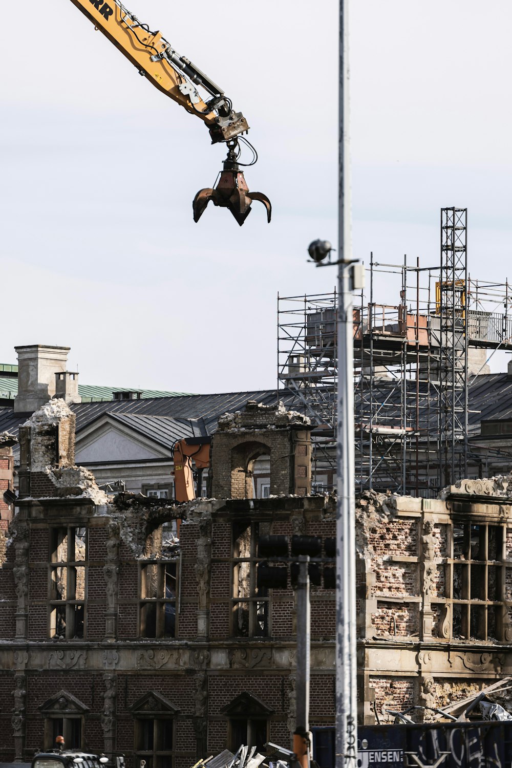 a crane is working on a large building