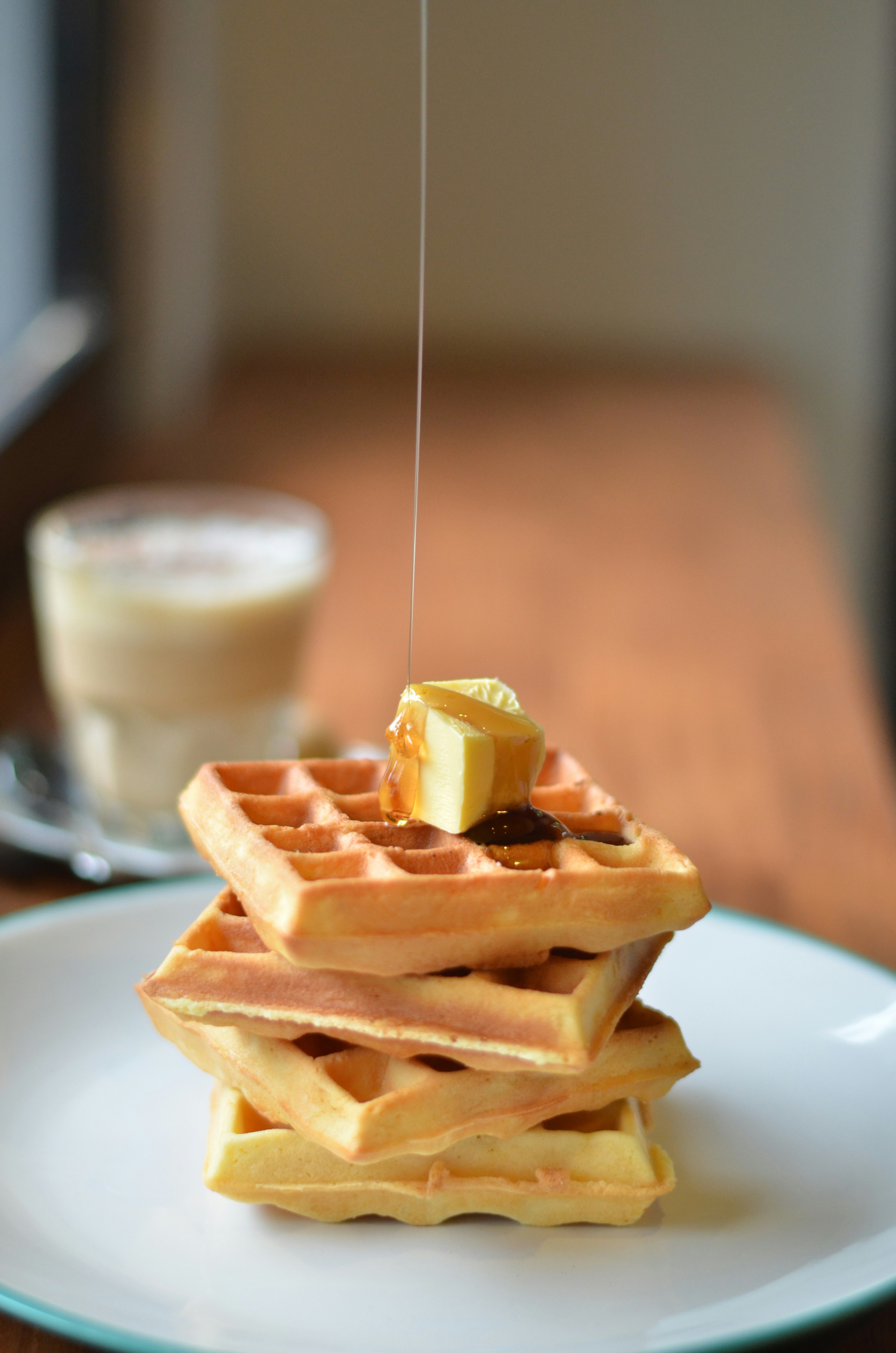 a stack of waffles sitting on top of a white plate