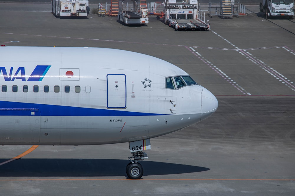 a large jetliner sitting on top of an airport tarmac