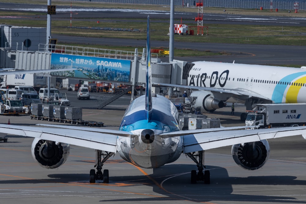 a large jetliner sitting on top of an airport tarmac