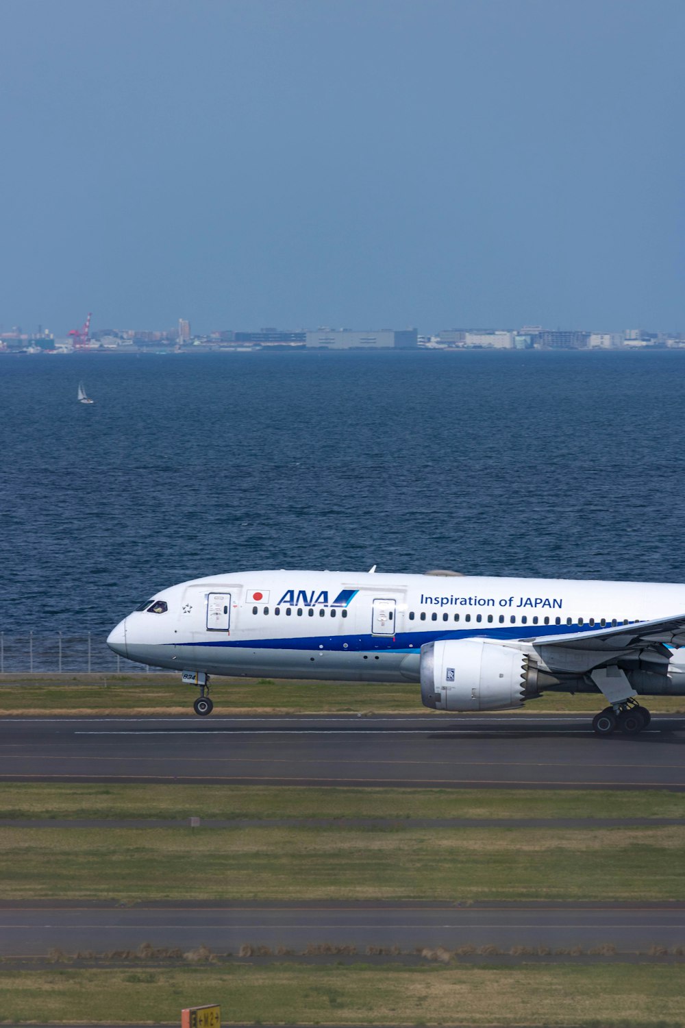 a large jetliner sitting on top of an airport runway