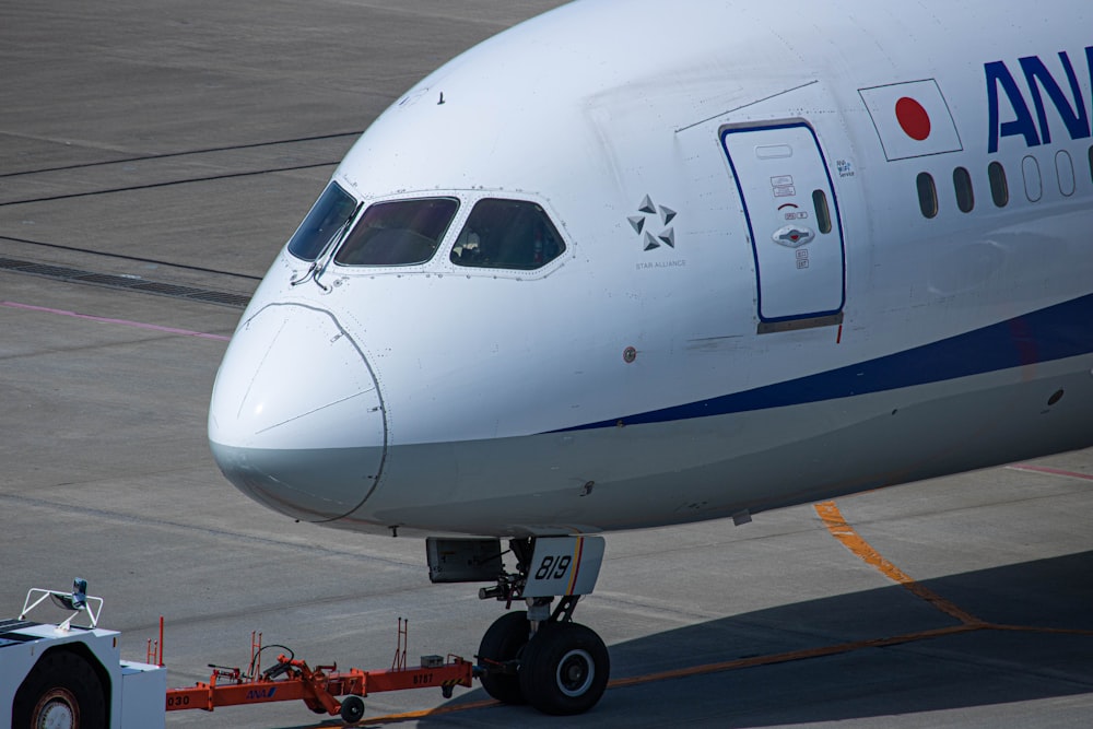 a large jetliner sitting on top of an airport tarmac