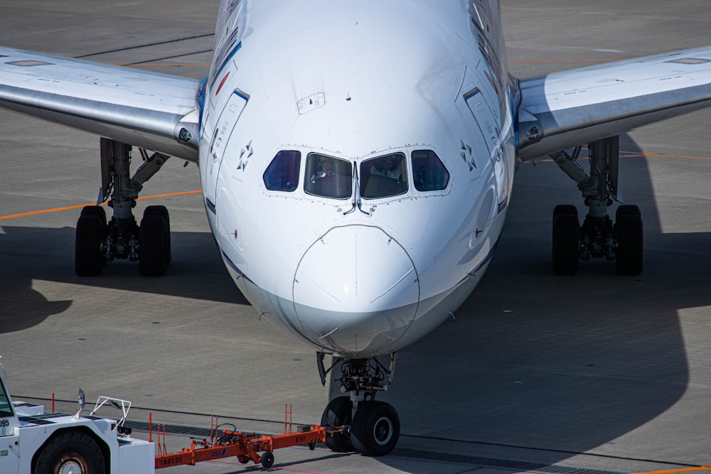 a large jetliner sitting on top of an airport tarmac