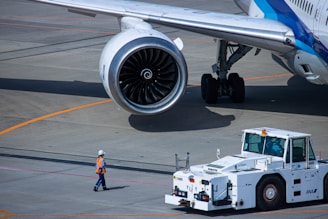 a large jetliner sitting on top of an airport tarmac