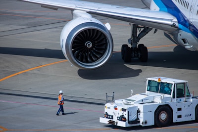 a large jetliner sitting on top of an airport tarmac