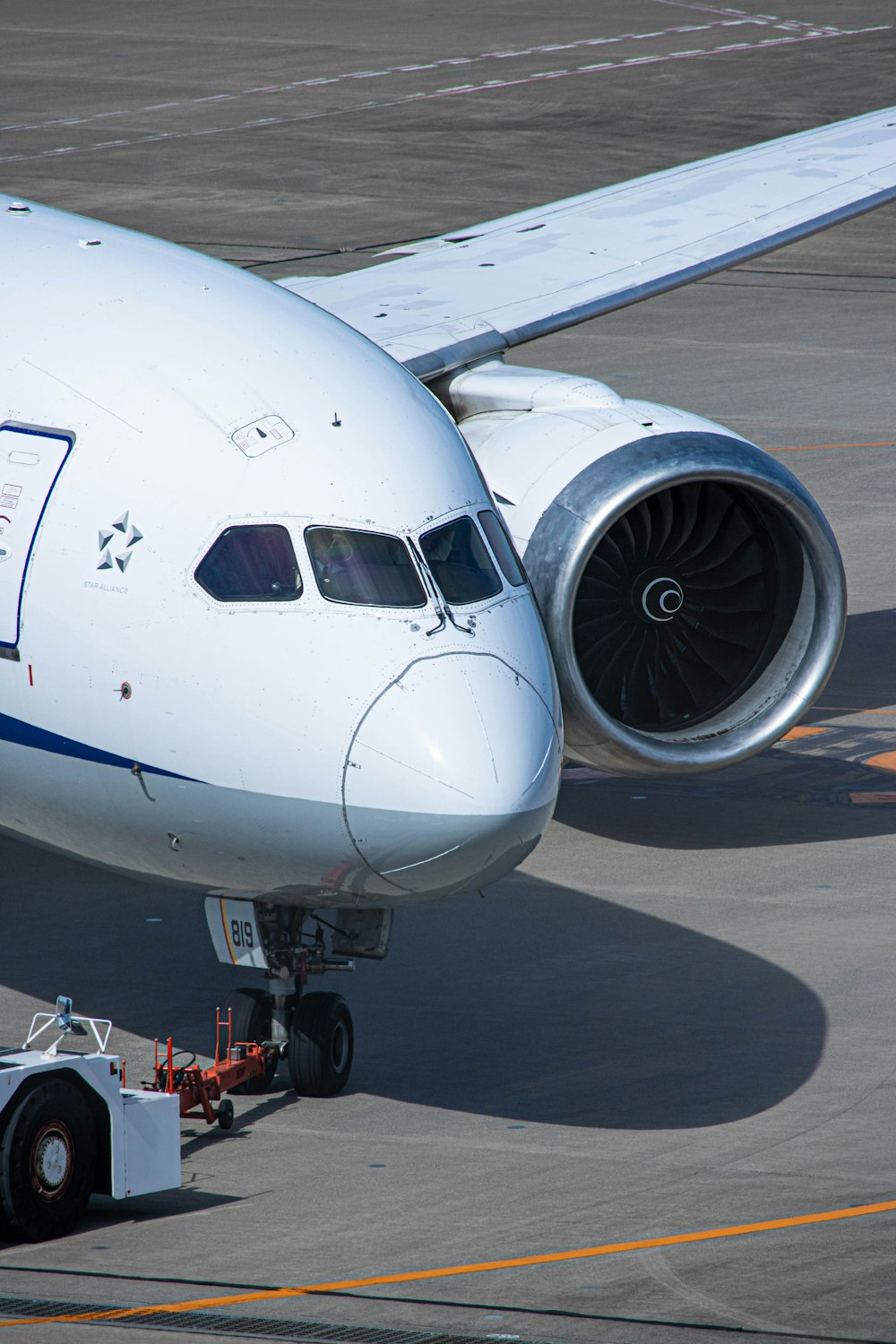 a large jetliner sitting on top of an airport tarmac