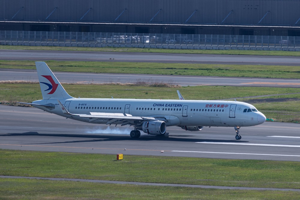 a large jetliner sitting on top of an airport runway