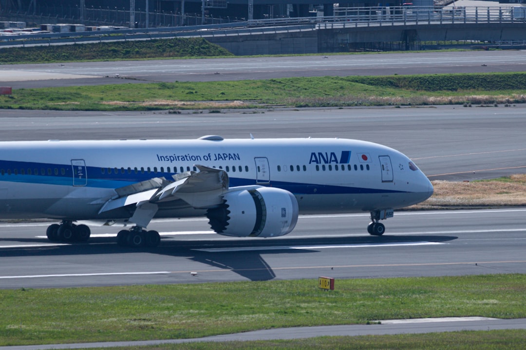 a large jetliner sitting on top of an airport runway,