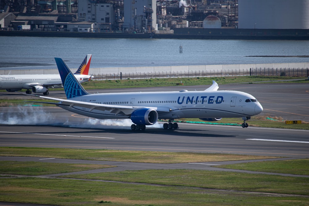 a large jetliner taking off from an airport runway