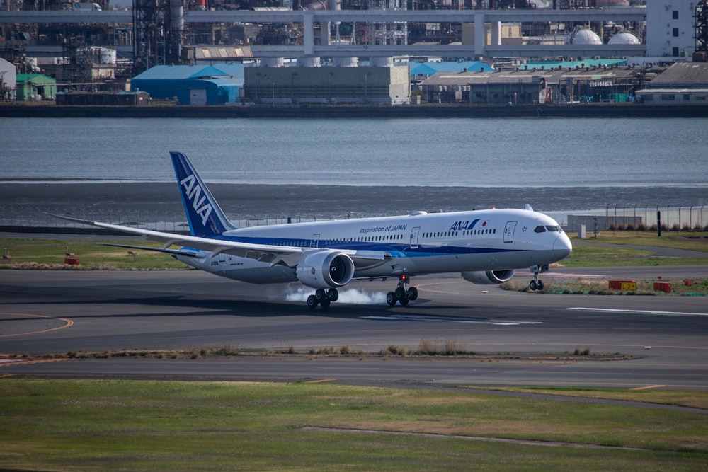 a large jetliner sitting on top of an airport runway