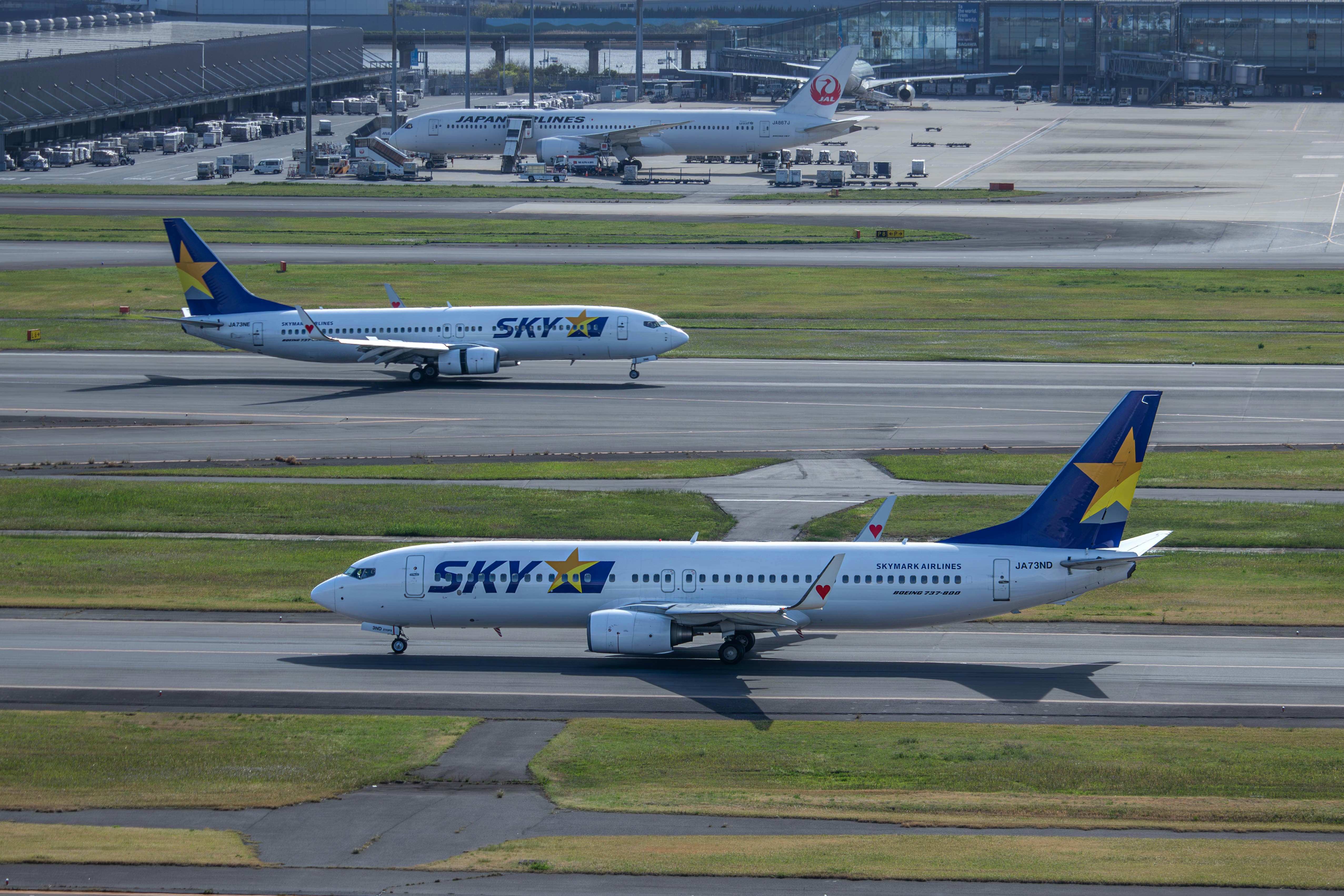 two airplanes on a runway at an airport Via Unsplash (by Ryuno)