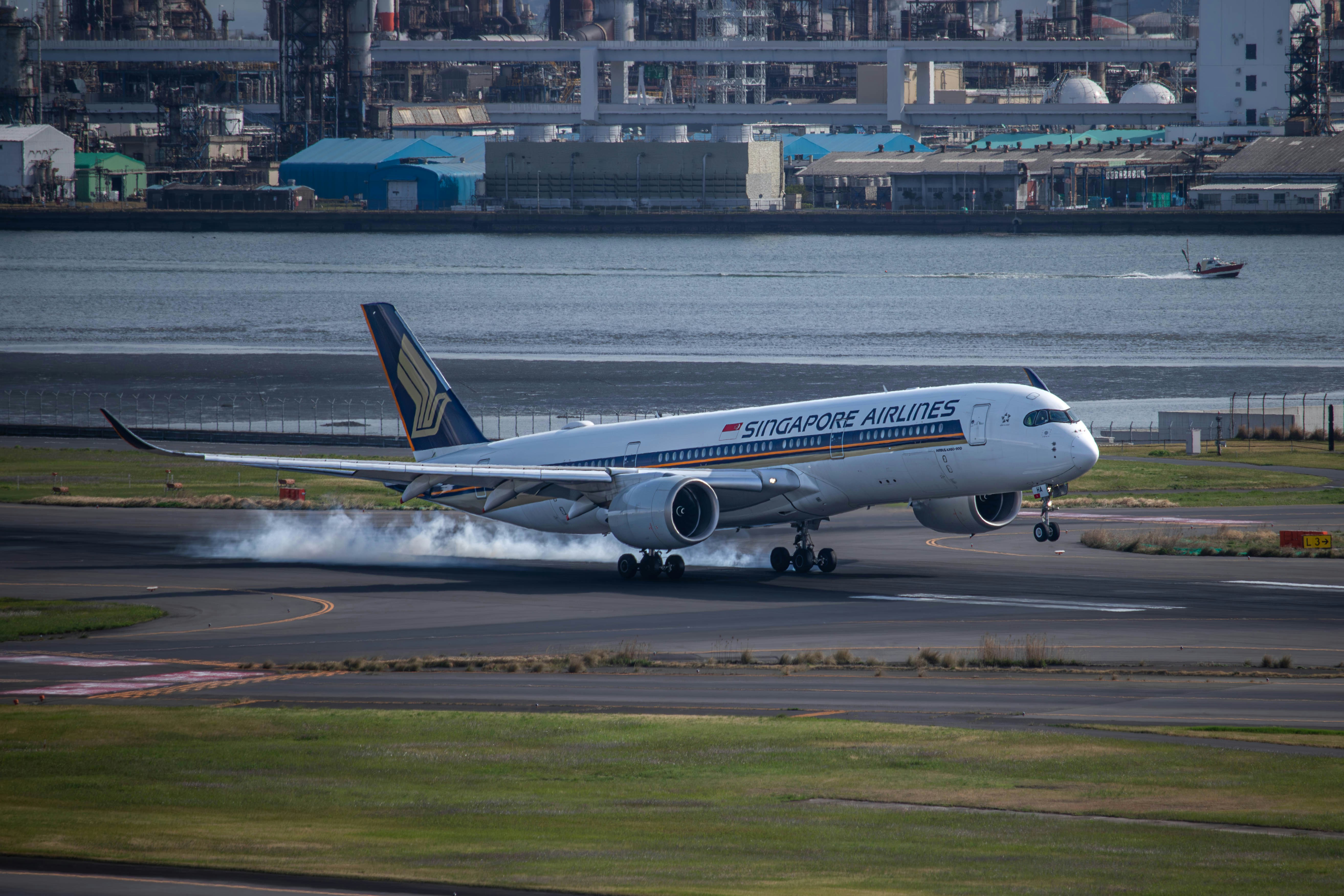 a large jetliner taking off from an airport runway