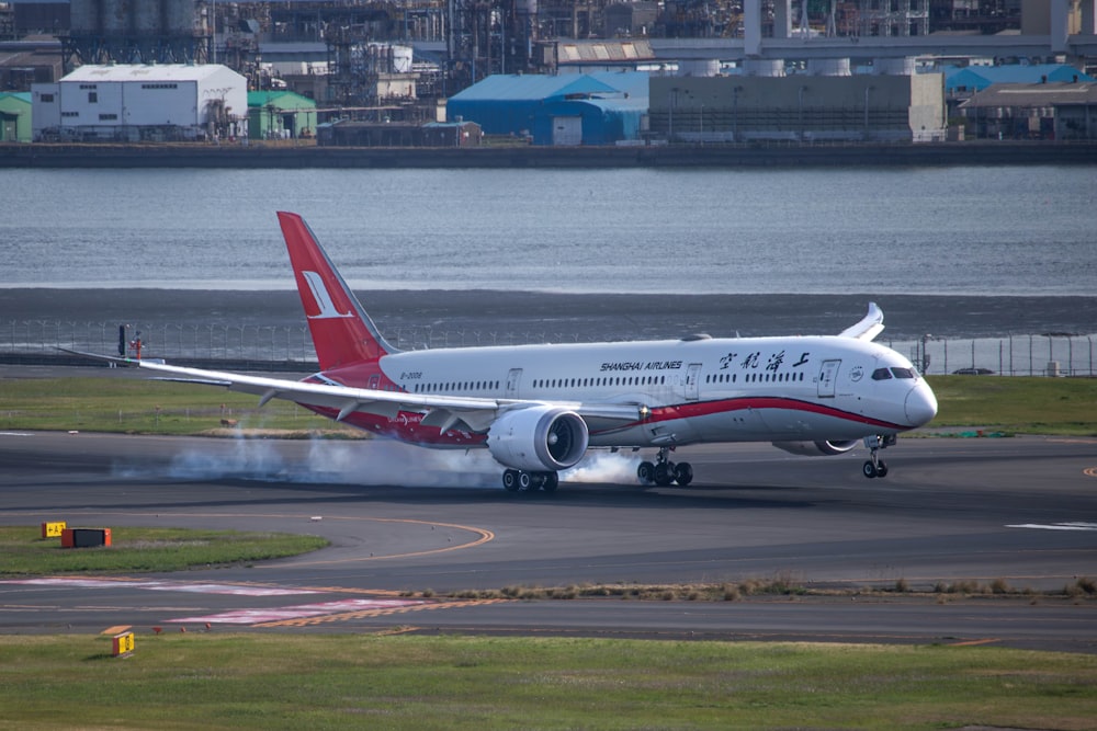 a large jetliner taking off from an airport runway